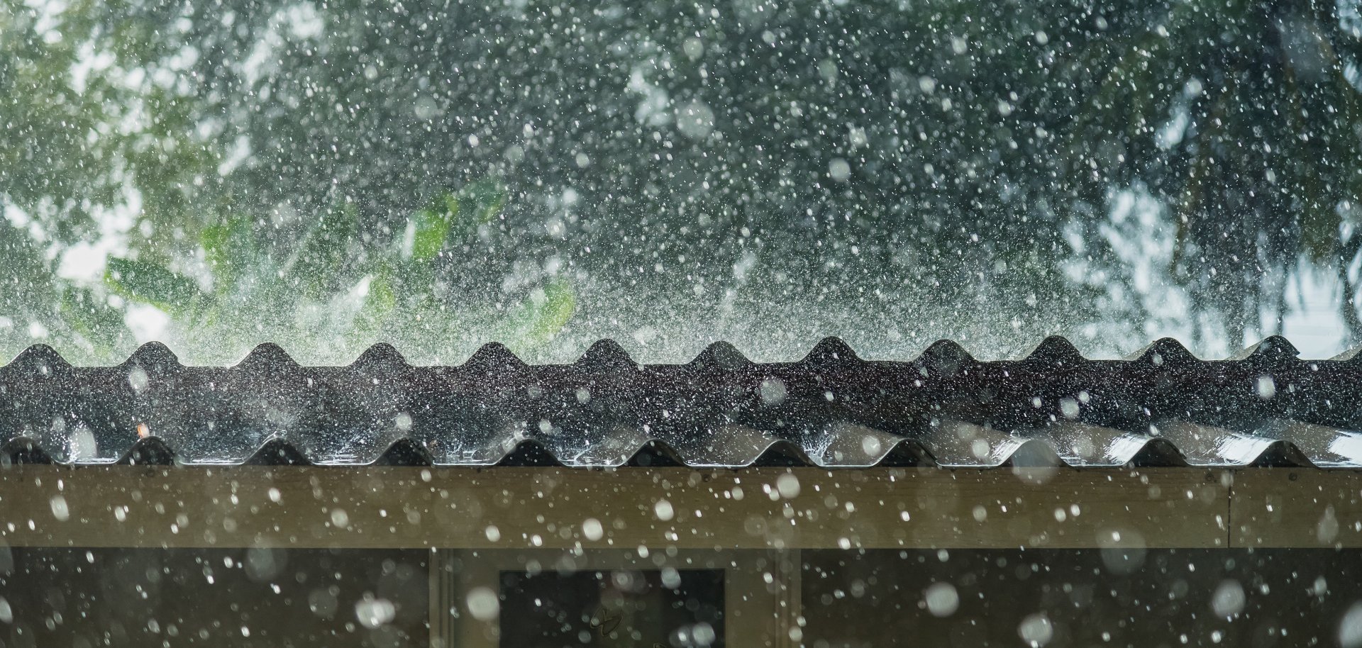 Storm rain on the roof of the house.