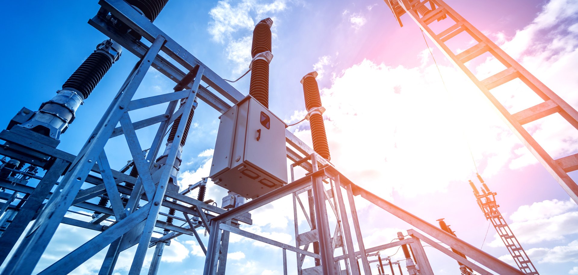 Construction of a power transmission substation on a background of blue sky